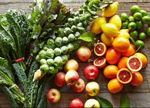 a group of fruits and vegetables on a wood surface Healthy Weight Loss Diets Wellingborough