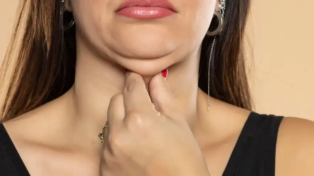 An image of a woman with double chin, sad, worried : Non Surgical Double Chin Removal Treatment in Wellingborough, UK